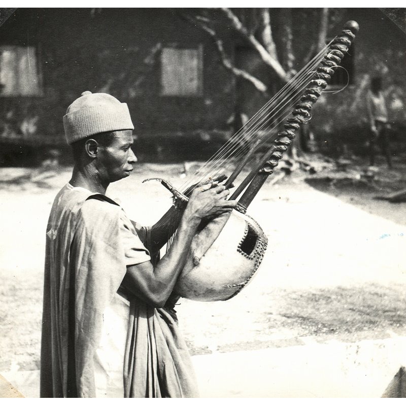 Mandingo praise song, preceded by tuning of Kora